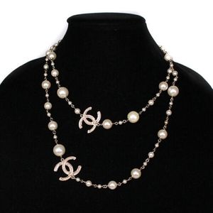 *SOLD* Chanel - 41 in Long Pearl CC Charm Necklace